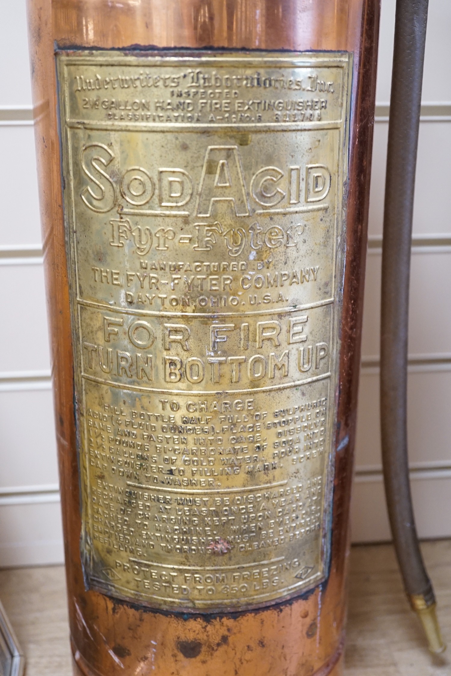 SodAcid extinguisher, in copper with large brass label, 60cms high